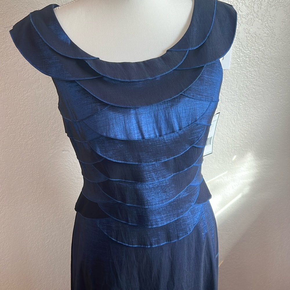 Floor length “petite size” iridescent navy blue sleeveless dress.